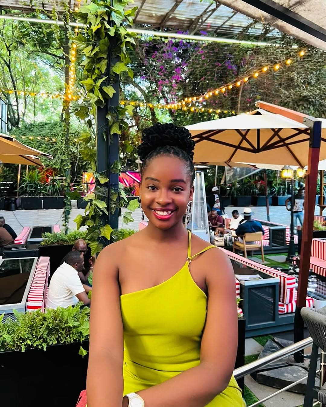 Diana in yellow dress at restaurant